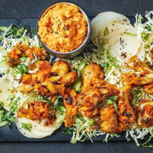 Barbecue wings with mash potato and stream vegetables